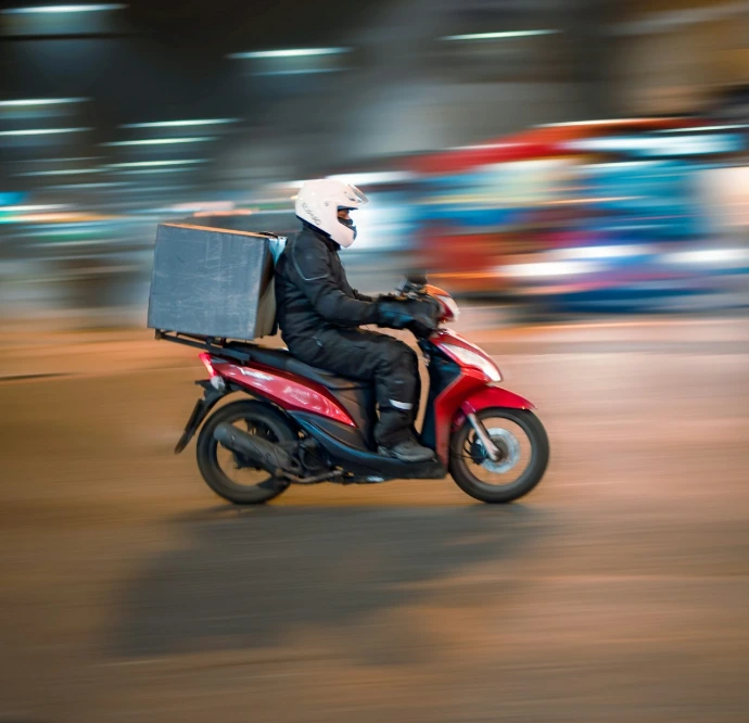 man riding motorcycle on road during daytime